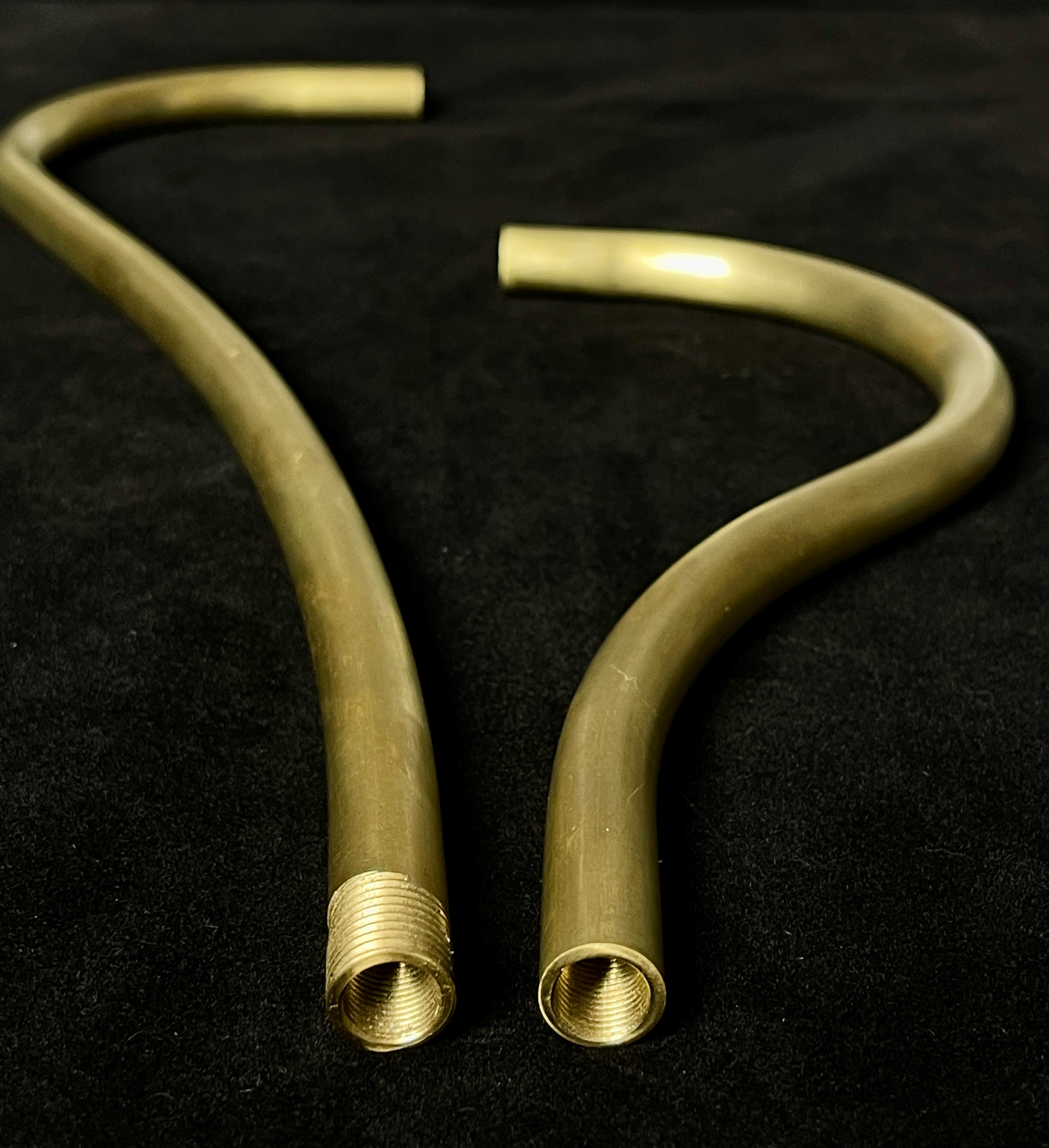 Custom bent brass tubes showing threading and different radii bends on a variety on lengths